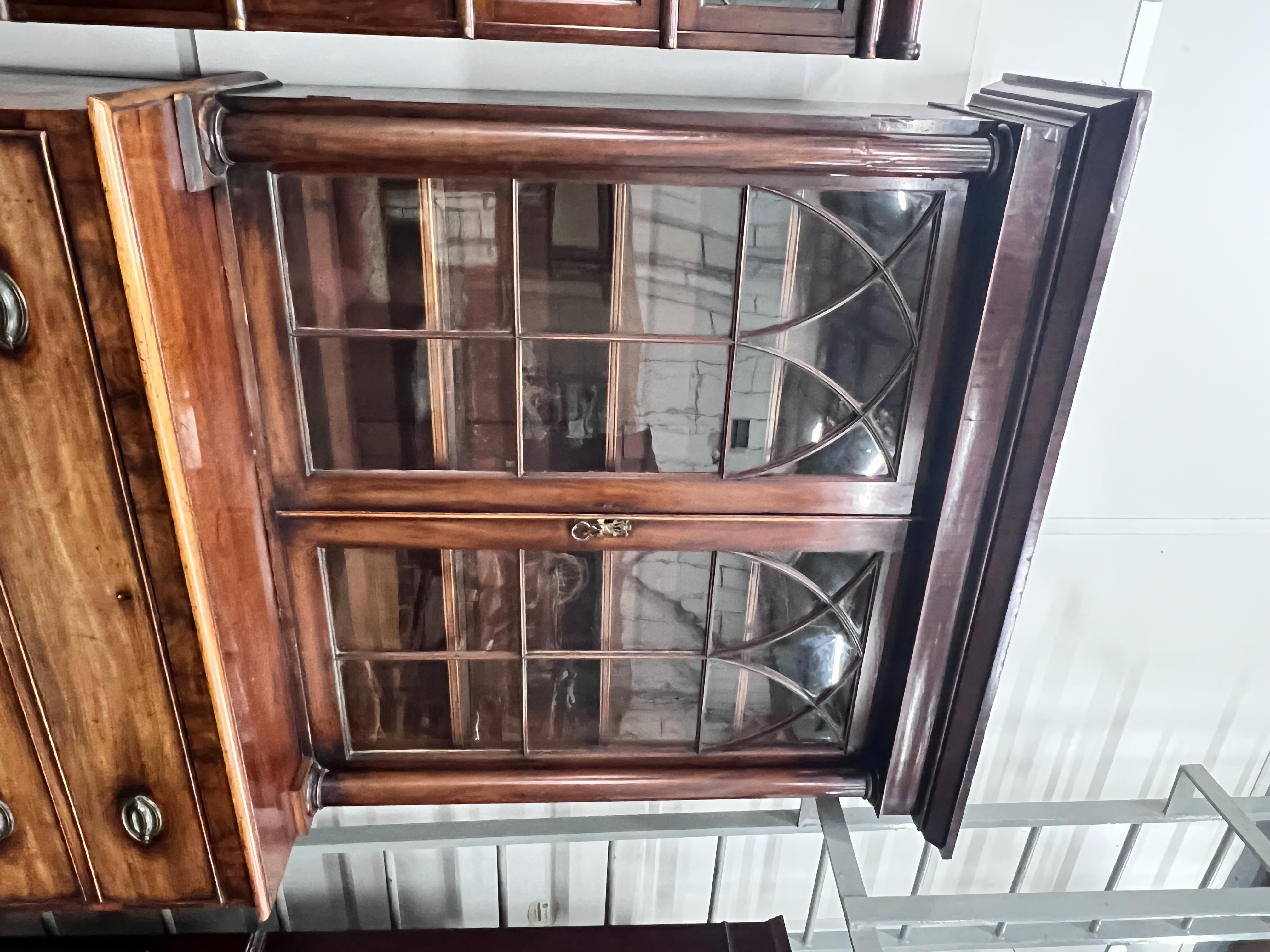 A George IV mahogany secretaire bookcase (top associated), width 125cm, depth 56cm, height 232cm
